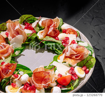Creative salad wreath with fresh ingredients and vibrant colors Creative salad wreath with fresh ingredients and vibrant colors 123268770