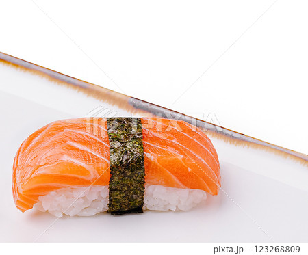 Fresh sushi with salmon topping served on a clean plate Fresh sushi with salmon topping served on a clean plate 123268809