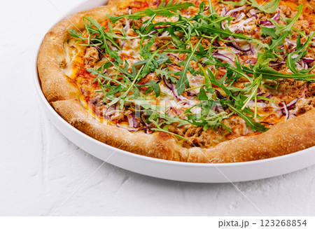 Fresh tuna and arugula pizza on white background 123268854