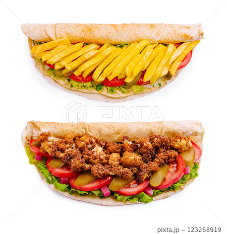 Delicious sandwiches with fried chicken and fries in refreshing wraps Delicious sandwiches with fried chicken and fries in refreshing wraps 123268919