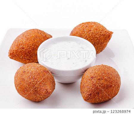 Delicious fried snacks served with creamy dipping sauce 123268974