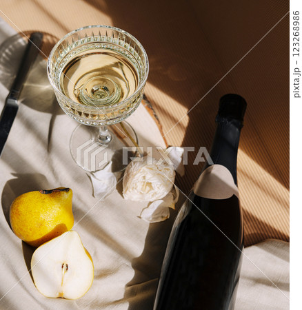 Elegant drink setup with sparkling wine and fresh fruits Elegant drink setup with sparkling wine and fresh fruits 123268986