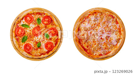 Freshly made pizzas topped with tomatoes and onions in a restaurant Freshly made pizzas topped with tomatoes and onions in a restaurant 123269026