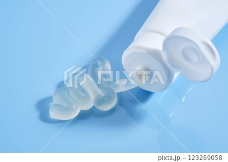 Gel toothpaste in a tube on a blue background. Gel toothpaste in a tube on a blue background. 123269058