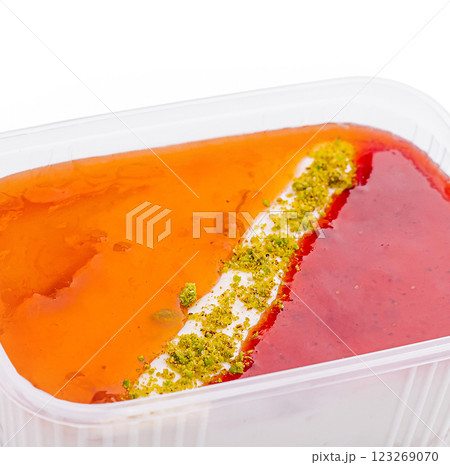 Colorful dessert with layers of orange and red flavors 123269070