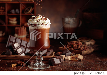 Hot chocolate topped with whipped cream and sprinkled with chocolate chips. 123269644