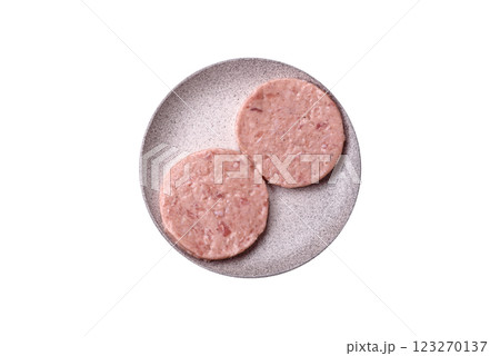 Raw chicken burger cutlet with salt, spices and herbs 123270137