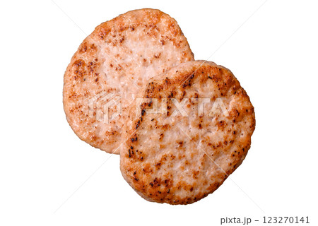 Grilled chicken burger cutlet with salt, spices and herbs Grilled chicken burger cutlet with salt, spices and herbs 123270141