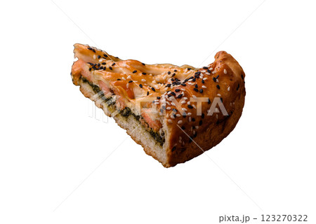 Pieces of quiche with salmon, spinach or broccoli, salt and spices 123270322