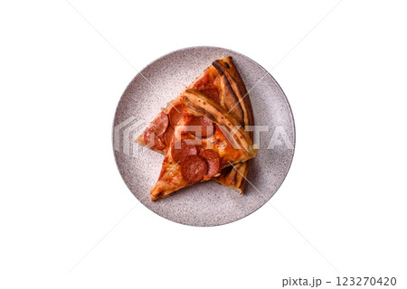 Pepperoni pizza with sausage, mozzarella cheese, tomatoes, salt and spices 123270420