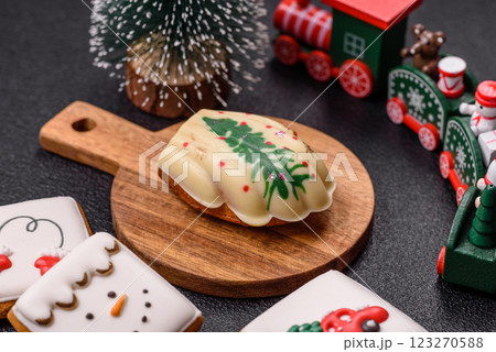 Sweet madeleine sponge cookies covered with colored chocolate 123270588