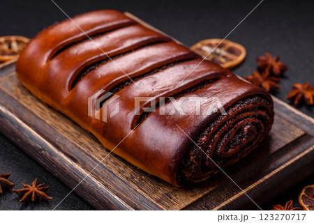 Sweet homemade roll with poppy seeds Sweet homemade roll with poppy seeds 123270717