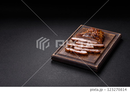 Juicy pork steak baked on the grill with salt, spices and herbs Juicy pork steak baked on the grill with salt, spices and herbs 123270814