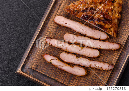Juicy pork steak baked on the grill with salt, spices and herbs 123270818