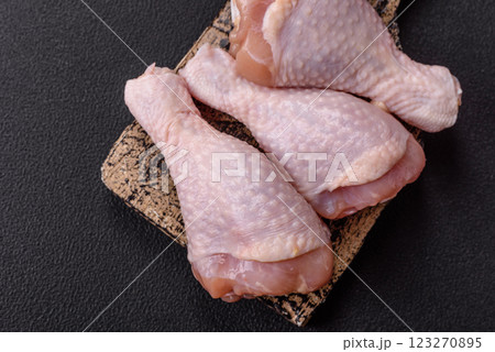 Raw chicken legs with salt, spices and herbs Raw chicken legs with salt, spices and herbs 123270895