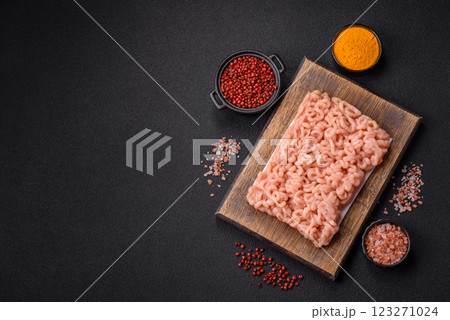 Raw minced chicken with salt, spices and herbs Raw minced chicken with salt, spices and herbs 123271024