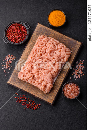 Raw minced chicken with salt, spices and herbs Raw minced chicken with salt, spices and herbs 123271025
