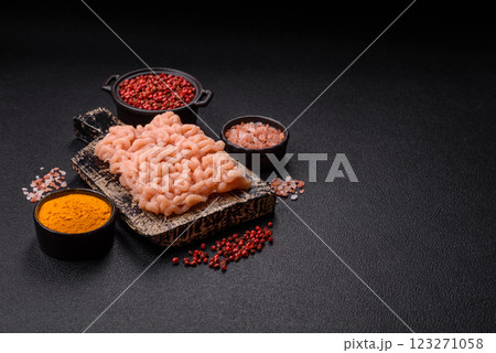 Raw minced chicken with salt, spices and herbs Raw minced chicken with salt, spices and herbs 123271058