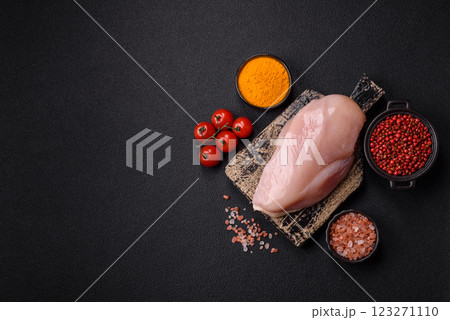 Pieces of raw chicken or turkey fillet with salt, spices and herbs Pieces of raw chicken or turkey fillet with salt, spices and herbs 123271110