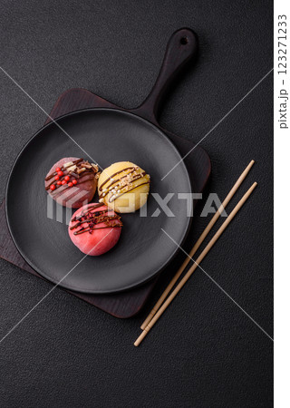 Delicious colorful asian mochi sweets with rice dough shell and fruit filling Delicious colorful asian mochi sweets with rice dough shell and fruit filling 123271233