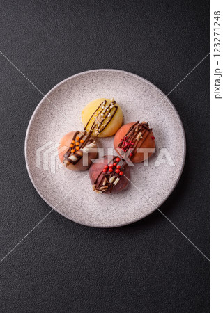Delicious colorful asian mochi sweets with rice dough shell and fruit filling Delicious colorful asian mochi sweets with rice dough shell and fruit filling 123271248