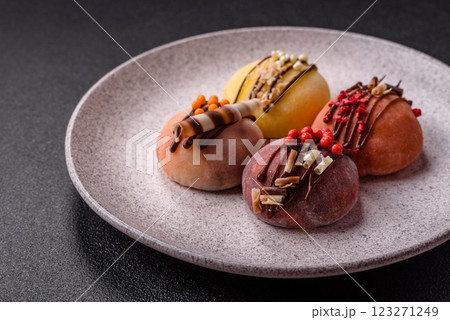 Delicious colorful asian mochi sweets with rice dough shell and fruit filling Delicious colorful asian mochi sweets with rice dough shell and fruit filling 123271249
