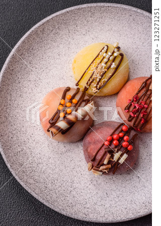 Delicious colorful asian mochi sweets with rice dough shell and fruit filling Delicious colorful asian mochi sweets with rice dough shell and fruit filling 123271251