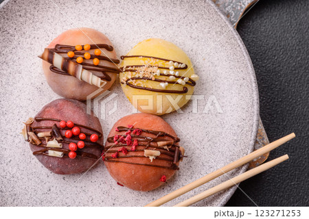 Delicious colorful asian mochi sweets with rice dough shell and fruit filling 123271253