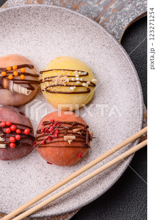 Delicious colorful asian mochi sweets with rice dough shell and fruit filling 123271254