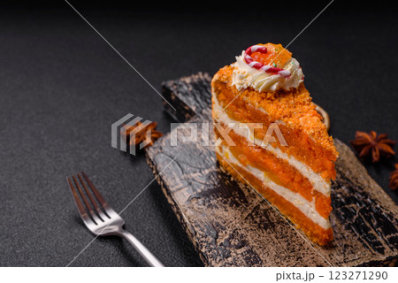 Piece of sweet layer cake with pumpkin or citrus flavor with cream Piece of sweet layer cake with pumpkin or citrus flavor with cream 123271290