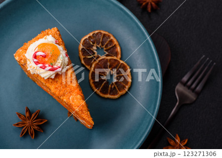 Piece of sweet layer cake with pumpkin or citrus flavor with cream 123271306