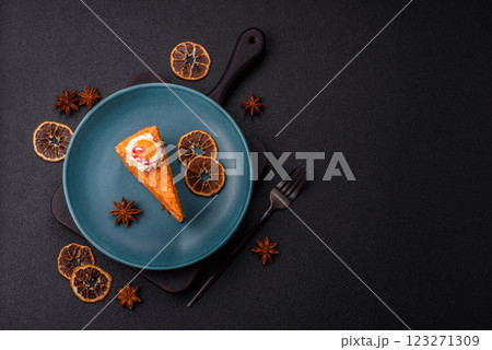 Piece of sweet layer cake with pumpkin or citrus flavor with cream Piece of sweet layer cake with pumpkin or citrus flavor with cream 123271309