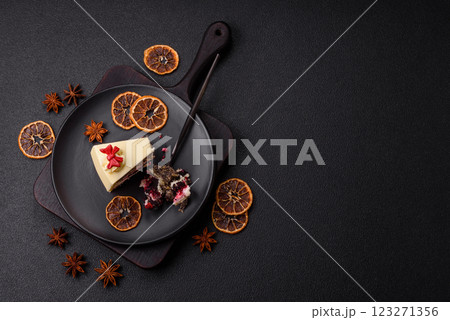 Piece of sweet layered cheesecake with cherries and poppy seeds 123271356
