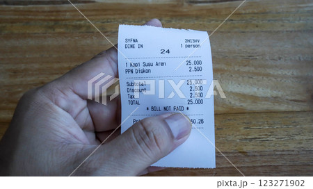 Bill receipt for one item of sugar palm milk coffee in Indonesian. Bill receipt for one item of sugar palm milk coffee in Indonesian. 123271902