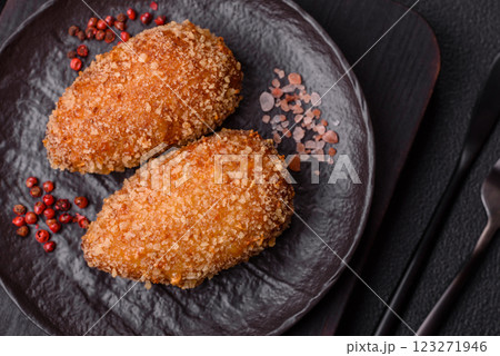 Delicious fresh cutlet or meatball Kiev style with filling 123271946