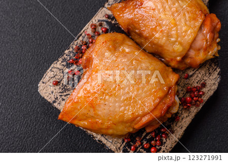 Chicken thighs fried with salt, spices and herbs 123271991