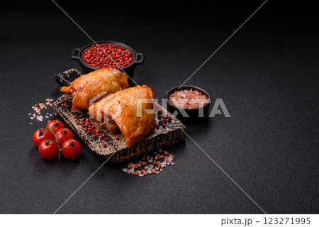 Chicken thighs fried with salt, spices and herbs 123271995