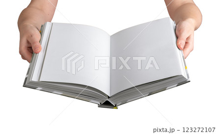 A person holding an open, blank hardcover book, displaying clean, white pages for writing, reading, 123272107