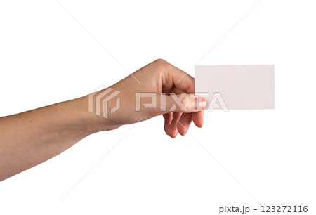 Female hand holding a blank business card, fingers positioned to present it forward. Symbolizing 123272116