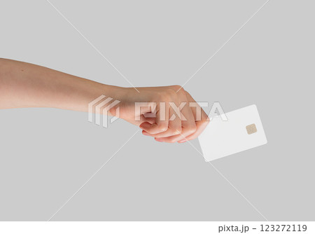 Female hand holding a blank credit card, ideal for showcasing advertising, promotions, and financial Female hand holding a blank credit card, ideal for showcasing advertising, promotions, and financial 123272119