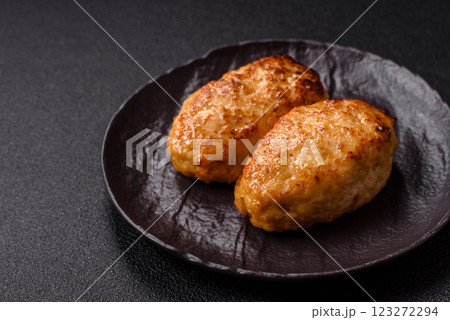 Delicious fresh fried minced fish cutlets with spices and herbs Delicious fresh fried minced fish cutlets with spices and herbs 123272294