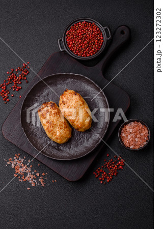 Delicious fresh fried minced fish cutlets with spices and herbs Delicious fresh fried minced fish cutlets with spices and herbs 123272302
