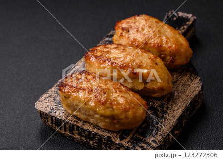Delicious fresh fried minced fish cutlets with spices and herbs Delicious fresh fried minced fish cutlets with spices and herbs 123272306
