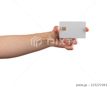 Female hand holding a credit card with a chip, showcasing it for payment, promotion, or financial 123272361