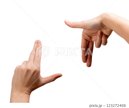 Female hands forming an L-shaped framing gesture, thumbs and index fingers creating a square to 123272408