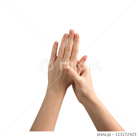 Female hands with well-groomed nails, gently spread and showing a glossy, elegant manicure. 123272425