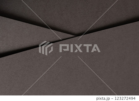 Dark espresso brown paper background with a smooth matte texture and subtle geometric lines. Rich Dark espresso brown paper background with a smooth matte texture and subtle geometric lines. Rich 123272494