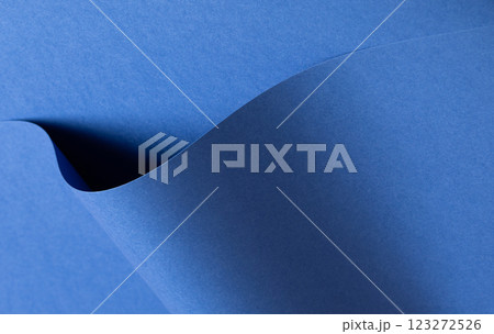 Deep sapphire blue paper background with a smooth texture and overlapping curved folds. Vibrant Deep sapphire blue paper background with a smooth texture and overlapping curved folds. Vibrant 123272526