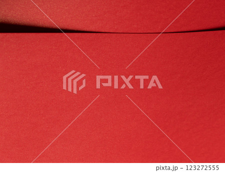 Fiery crimson paper background with a smooth texture and geometric lines. Rich scarlet tones and a Fiery crimson paper background with a smooth texture and geometric lines. Rich scarlet tones and a 123272555