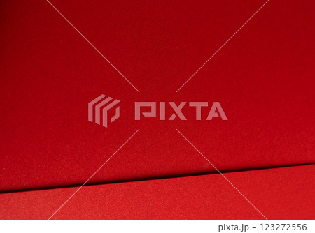 Fiery crimson paper background with a smooth texture and geometric lines. Rich scarlet tones and a Fiery crimson paper background with a smooth texture and geometric lines. Rich scarlet tones and a 123272556